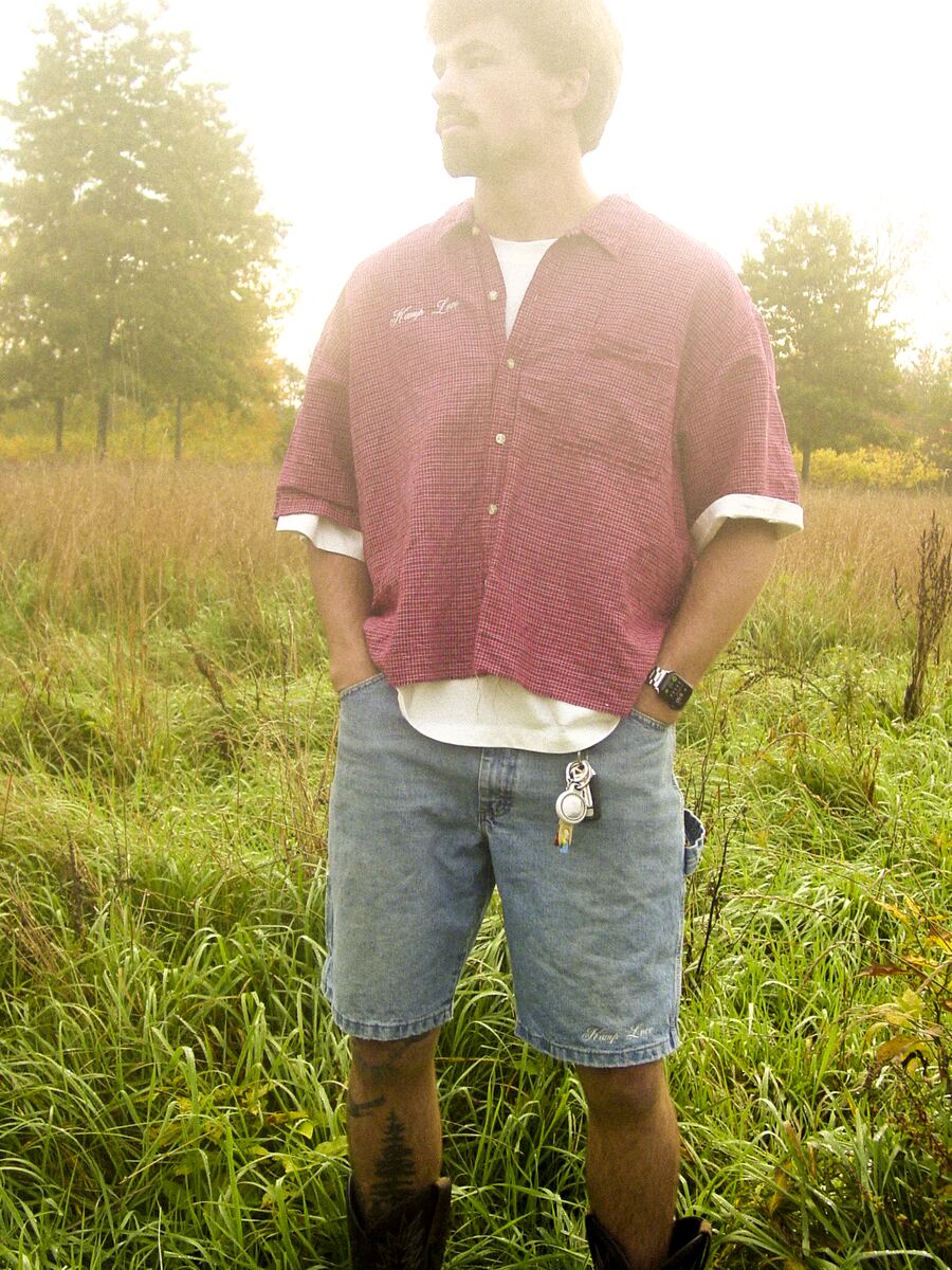 Red camp shirt with Kamp Love script on the chest