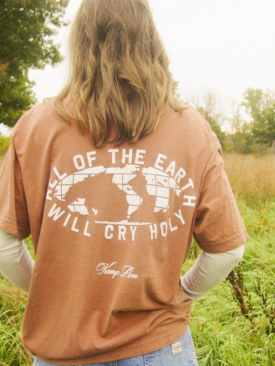 Orange tee, back print: All of the Earth Will Cry Holy